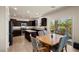 Eat-in kitchen features stainless appliances, granite counters and backyard access at 168 Springhouse St, Las Vegas, NV 89148
