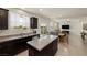 Open concept kitchen featuring granite countertops and views of the dining and living area at 168 Springhouse St, Las Vegas, NV 89148