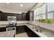 Well-equipped kitchen featuring granite counters, stainless steel appliances, and ample cabinet space at 168 Springhouse St, Las Vegas, NV 89148