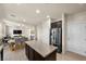 Open concept kitchen featuring a central island, stainless appliances, and seamless access to living spaces at 168 Springhouse St, Las Vegas, NV 89148