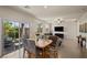 Open living area features hardwood floors, ample natural light, and backyard access at 168 Springhouse St, Las Vegas, NV 89148