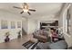 Bright living room with neutral walls, stylish furniture, and open access to the kitchen at 168 Springhouse St, Las Vegas, NV 89148