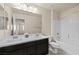 Bathroom featuring double vanity with marble countertop, shower, and neutral colors at 168 Springhouse St, Las Vegas, NV 89148