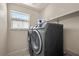 Laundry room featuring new appliances and natural light at 168 Springhouse St, Las Vegas, NV 89148