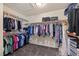 Spacious walk-in closet provides ample storage with hanging racks and shelves for organized clothing and accessories at 168 Springhouse St, Las Vegas, NV 89148