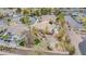 A beautiful home featuring a pool, luscious landscaping, private driveway, and a charming playground in the backyard at 1720 Sand Storm Ct, Henderson, NV 89074