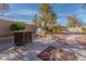 Backyard featuring a built-in BBQ area and ample patio space for entertaining at 1720 Sand Storm Ct, Henderson, NV 89074