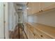 Bright hallway with hardwood floors and custom built-in storage cabinets at 1720 Sand Storm Ct, Henderson, NV 89074