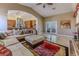 Spacious living room with view to the kitchen and outdoor area at 1720 Sand Storm Ct, Henderson, NV 89074