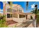 Exterior angle of the house showcases its architectural style and surrounding greenery at 1721 Derbyshire Dr, Las Vegas, NV 89117