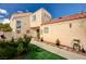 Charming home exterior featuring a well-maintained lawn, walkway, and desert landscaping at 1721 Derbyshire Dr, Las Vegas, NV 89117