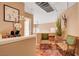 Bright hallway showcasing hardwood floors, stylish decor, and comfortable seating, creating a welcoming transition between spaces at 1721 Derbyshire Dr, Las Vegas, NV 89117