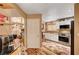Updated kitchen features stainless steel appliances, stylish backsplash, and modern design at 1721 Derbyshire Dr, Las Vegas, NV 89117