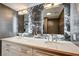 Stylish bathroom featuring a double vanity with marble countertop and sophisticated lighting at 205 E Harmon Ave # 1010, Las Vegas, NV 89169