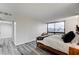 Bright bedroom offers scenic city views from a wide window, with stylish gray flooring at 205 E Harmon Ave # 1010, Las Vegas, NV 89169