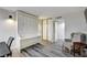 Cozy bedroom featuring a built-in desk, Murphy bed, wood-look flooring and plenty of natural light at 205 E Harmon Ave # 1010, Las Vegas, NV 89169