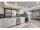 Well-lit kitchen with hardwood floors, stainless appliances and modern cabinetry at 205 E Harmon Ave # 1010, Las Vegas, NV 89169