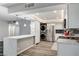 Bright kitchen boasts modern cabinets, stainless steel appliances, a center island, and hardwood floors at 205 E Harmon Ave # 1010, Las Vegas, NV 89169