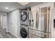 Updated kitchen features stainless steel appliances and stacked laundry machines at 205 E Harmon Ave # 1010, Las Vegas, NV 89169