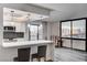 Modern kitchen with breakfast bar seating featuring stainless steel appliances and city views at 205 E Harmon Ave # 1010, Las Vegas, NV 89169
