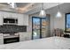 Modern kitchen boasts stainless steel appliances, stylish backsplash, and a breakfast bar with skyline view at 205 E Harmon Ave # 1010, Las Vegas, NV 89169