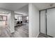 Inviting living area with light gray flooring that transitions to a modern kitchen and dining area at 205 E Harmon Ave # 1010, Las Vegas, NV 89169