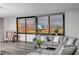 Cozy living room featuring comfortable seating and a stunning cityscape view through expansive windows at 205 E Harmon Ave # 1010, Las Vegas, NV 89169