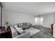 Cozy living room featuring two comfortable sofas, wood floors, and a view into the kitchen at 205 E Harmon Ave # 1010, Las Vegas, NV 89169