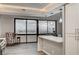 Bright and airy living space features hardwood floors and a panoramic city view from expansive windows at 205 E Harmon Ave # 1010, Las Vegas, NV 89169