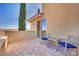 Outdoor balcony with two chairs and a table at 21 Via Mantova # 3, Henderson, NV 89011