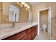 Elegant bathroom showcasing a double vanity with modern fixtures and a separate toilet room at 21 Via Mantova # 3, Henderson, NV 89011