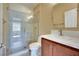 The bathroom features glass shower doors, light tile, a sink, and a toilet at 21 Via Mantova # 3, Henderson, NV 89011