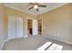 Bright bedroom featuring double door closet and ensuite bathroom at 21 Via Mantova # 3, Henderson, NV 89011