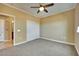 Comfortable bedroom featuring a ceiling fan, neutral paint, and a double door closet at 21 Via Mantova # 3, Henderson, NV 89011