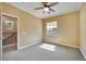 Bedroom featuring a ceiling fan, carpeted floors, and natural light from a window at 21 Via Mantova # 3, Henderson, NV 89011