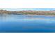 Expansive lake view showcasing the tranquil waters and the distant community and mountains, promising a serene living environment at 21 Via Mantova # 3, Henderson, NV 89011