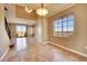 Spacious living room featuring tiled flooring, recessed lighting, and access to an outdoor balcony with scenic views at 21 Via Mantova # 3, Henderson, NV 89011