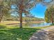Scenic pond surrounded by lush landscaping and walking paths, creating a serene and picturesque neighborhood atmosphere at 21 Via Mantova # 3, Henderson, NV 89011