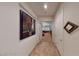 Hallway view showcasing doorway views into an office and a living room at 2309 Aztec Ruin Way, Henderson, NV 89044