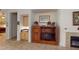 Living space showcasing a wet bar, fireplace, and a built-in entertainment center for relaxation and entertainment at 2309 Aztec Ruin Way, Henderson, NV 89044