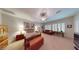 Main bedroom features ample space, natural light, neutral carpet, and a sitting area at 2309 Aztec Ruin Way, Henderson, NV 89044