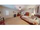 Spacious main bedroom with natural light, neutral carpet and wood furniture at 2309 Aztec Ruin Way, Henderson, NV 89044