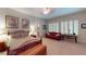 Bright main bedroom features a sitting area, large windows, and comfortable ambiance at 2309 Aztec Ruin Way, Henderson, NV 89044