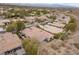 Wide aerial view of the homes in the area featuring tile roofs at 26 Moraine Dr, Henderson, NV 89052