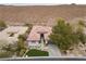 An aerial view of a single-Gathering home showcasing desert landscaping and a private driveway at 26 Moraine Dr, Henderson, NV 89052