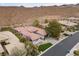 A spacious property featuring a three-car garage, desert landscaping, and attractive curb appeal at 26 Moraine Dr, Henderson, NV 89052