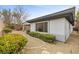 Landscaped backyard featuring gravel, mature bushes and privacy fence at 26 Moraine Dr, Henderson, NV 89052