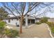 Back of the home with gravel backyard and patio at 26 Moraine Dr, Henderson, NV 89052
