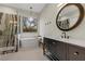 Chic bathroom with a glass shower, freestanding tub, and sleek vanity at 26 Moraine Dr, Henderson, NV 89052