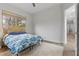 Cozy bedroom with window and hardwood floors at 26 Moraine Dr, Henderson, NV 89052
